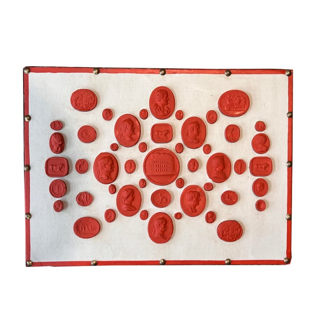 Set of three Grand Tour revival, Neoclassical style red painted and waxed plaster intaglio casts. the sets are displayed...