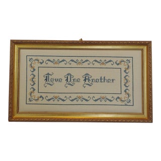 Vintage 1970s Embroidered Handmade Cross Stitch Needlepoint "Love One Another" in Gold Framed Wall Art For Sale