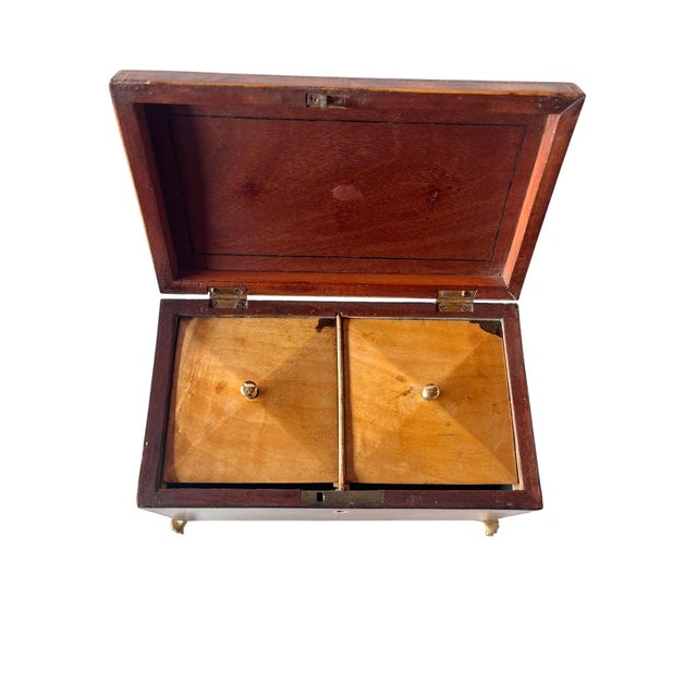 n elegant English Georgian mahogany tea caddy dating to circa 1800. The rectangular case is beautifully figured and...