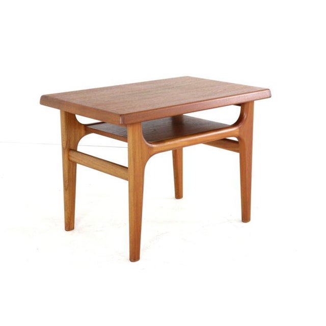 Exquisitely designed and crafted! This compact coffee/side table, made entirely of solid teak and designed by Niels Bach,...