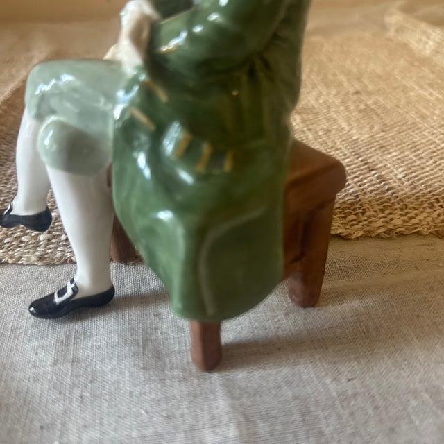 A delightful and dapper ceramic gentleman, seated with elegance and full of personality. This whimsical figure wears...