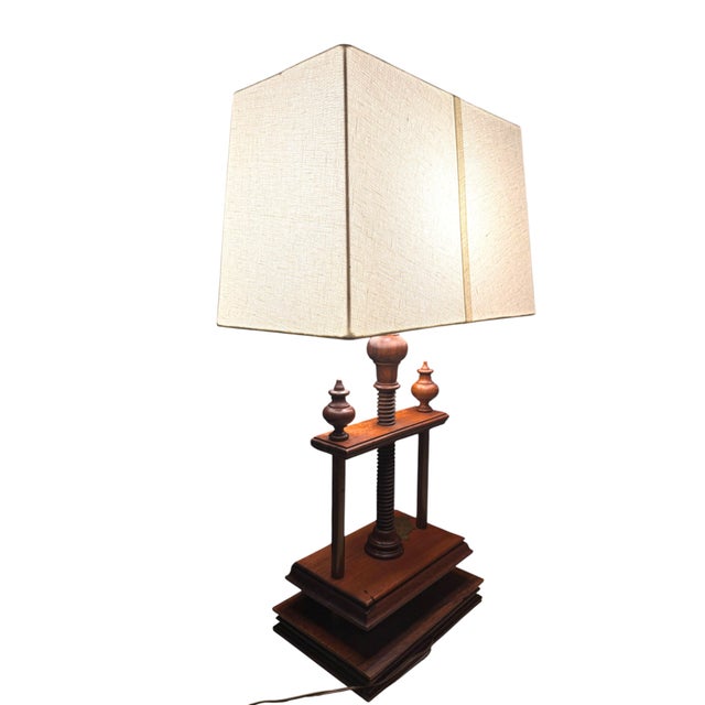 Vintage Norman Perry wood book press lamp. Designed to resemble a traditional book press, the solid wood base adds warmth...