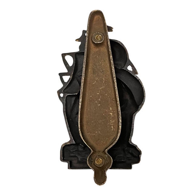 Add an impressive touch to your front door with this handsome English cast brass door knocker with attached striker plate...