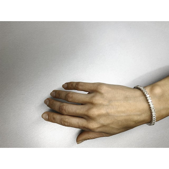 This exquisite bracelet is a captivating piece that draws attention with its elegant design and striking diamond...