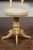 An Austrian Biedermeier bleached burled walnut swivel chair from the mid-19th century, with new upholstery. Born in...