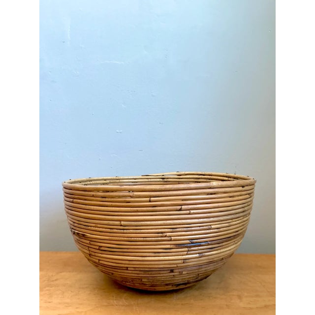 Handcrafted with meticulous horizontal pencil reed coiling, this vintage decorative bowl features a deep, gracefully...