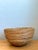 Handcrafted with meticulous horizontal pencil reed coiling, this vintage decorative bowl features a deep, gracefully...