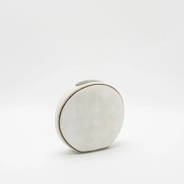 This exquisite vase by R&Y Augousti captures the essence of artisanal craftsmanship with its luxurious shagreen surface,...