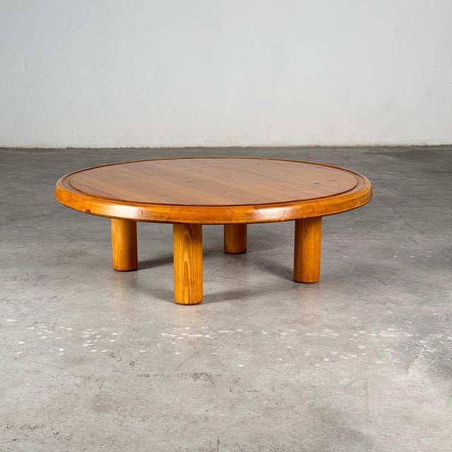 Rare round coffee or sofa table in solid stained pine, produced in France during the late 1960s. The design captures the...