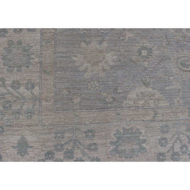 Modern Oushak with Floral Motifs with Cream, Grey, Blue, and Powder Blue. Keivan Woven Arts; rug AWR-17319 Country of...