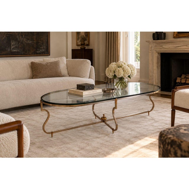 Tommi Parzinger, American Mid-Century Modern, Coffee or Cocktail Table, Brushed Steel, Brass, Glass, USA, 1950s An elegant...