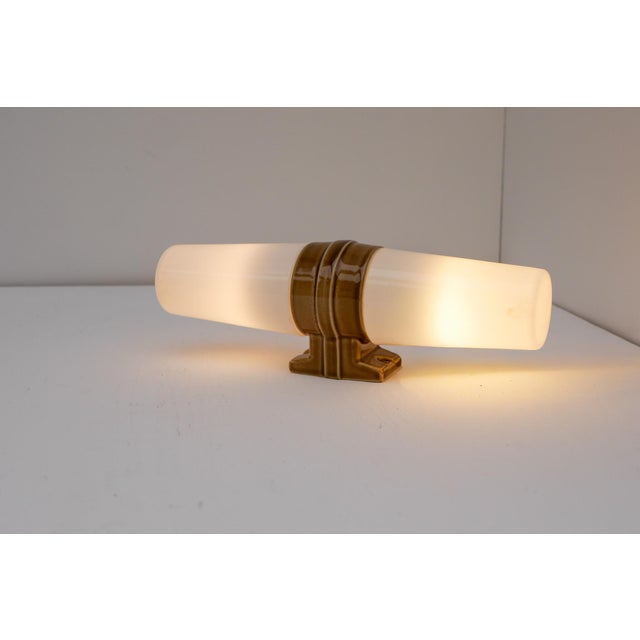 A rare mid-century modern double wall sconce designed by sigvard bernadotte for ifö, sweden, circa 1950s. this elegant...