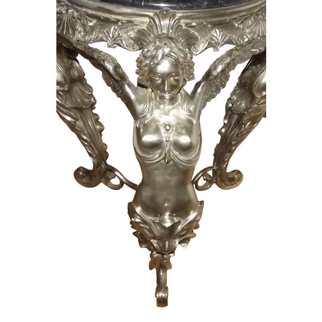 Absolutely stunning 20th Century Neo-Classical French Silvered Bronze Gueridon with Angels. This piece has incredible...