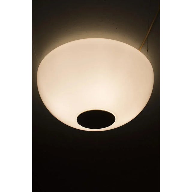 Wonderful Big Glass Ceiling Lamp with a Brass Circle. In good vintage condition. Measurements D. 23.5 cm; Ø 50 cm. Up to...