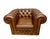 British classic Chesterfield leather club chair with deep button tufting and rolled arms. Solid frame with bun feet and...
