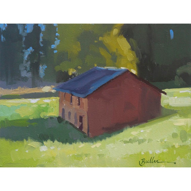 This oil on panel artwork depicts a solitary barn nestled in a lush green landscape, bathed in warm sunlight that creates...