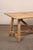 A rustic Italian table with trestle legs and beam stretcher from the 19th century. This antique table from Italy features...