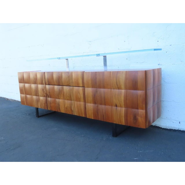 This wonderful Long Sideboard/Buffet is made out of wood, solid wood, walnut, glass and metal. This sideboard has a lovely...