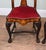 A decorative pair of Dutch style side chairs with elaborate floral marquetry in contrasting light woods The tall shaped...