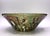 This bowl is wild. The clay is gritty and its texture shows through as speckled. The glaze on the inside has interspersed...
