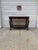 We have a beautiful vintage Empire Revival console table for sale. Featuring magnificent carved scroll legs, intricate...