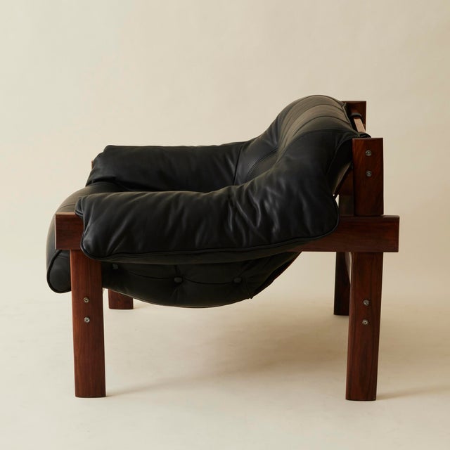 This MP-41 lounge chairs has been expertly reupholstered in a premium quality leather. Beautiful tufting and stitching...