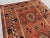 Islamic Antique Afghan Baluchi Rug With Geometric Tribal Medallion Design in Terracotta and Navy Rug For Sale - Image 3 of 11