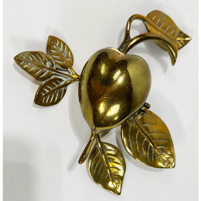 Charming vintage solid brass treasure box with fruit motif featuring leaf stemmed legs. Perfect for jewelry, stones or...