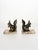 A charming pair of vintage bookends featuring patinated metal squirrel sculptures with a bronze finish, set upon veined...