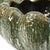 Handmade ceramic bowl featuring a beautifully organic, scalloped form and a richly variegated glaze in layered shades of...