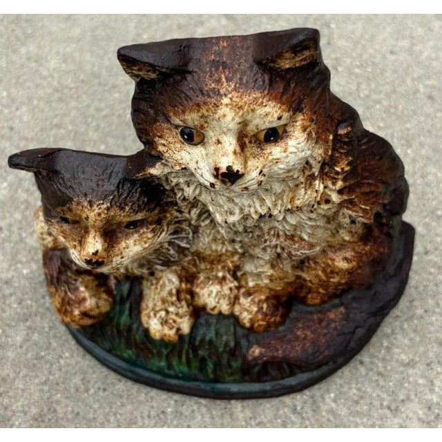 20Thc Original painted Hubley cast iron doorstop in original painted surface.Such wonderful worn patina and surface.A...