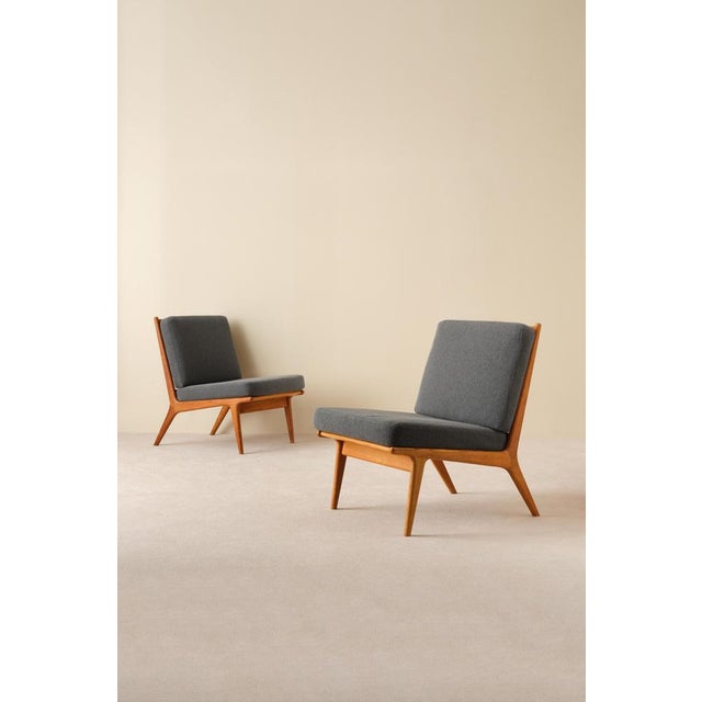 Designed by Karl-Erik Ekselius, produced by JOC in Vetlanda, Sweden, 1960s. Solid oak frame and newly upholstered cushions...