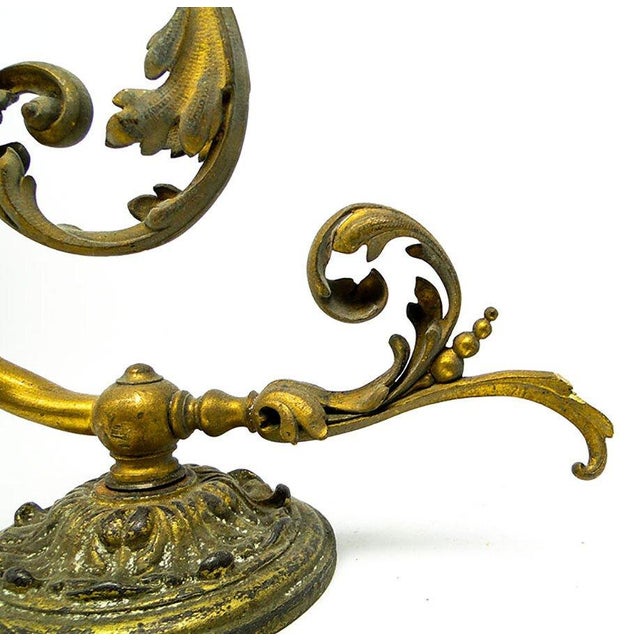 The Art Nouveau wall lamp comes from the beginning of the 20th century. It is in good condition and has a delicate patina....