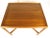 This is a classic occasional table by Edward Wormley for Dunbar. The piece features a sap walnut top and faceted legs.