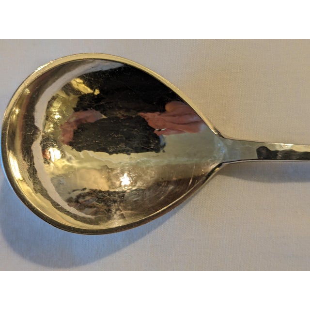 A lovely Danish Continental silver (.830) sugar or preserve spoon in a lightly hammered design with a large leaf pattern....