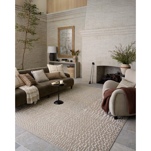 The Bexley Collection is a modern area rug with a loosely structured, organic design from Amber Lewis x Loloi. The rug...