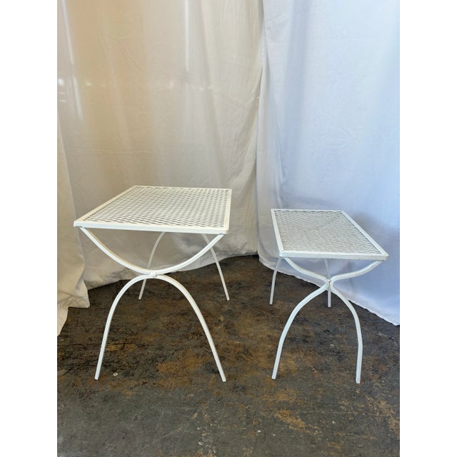 (2) Metal nesting tables by Salterini. The tables were professionally sandblasted and powder-coated white. They don’t have...