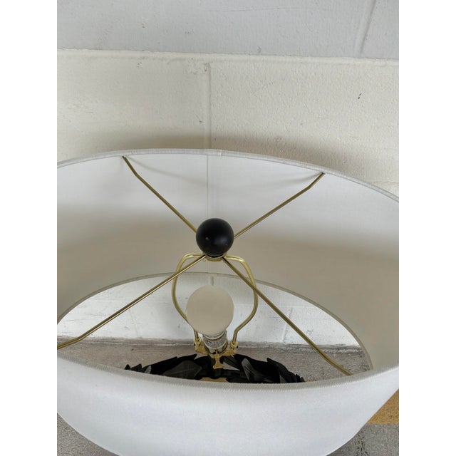Stylish Barbara Crosgrove Laurel Wreath Lamp. Black metal body with oval linen shade. Showroom floor sample.