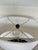 Stylish Barbara Crosgrove Laurel Wreath Lamp. Black metal body with oval linen shade. Showroom floor sample.