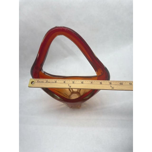 Striking mid-century Italian style hand-blown art glass basket featuring a vibrant flame-orange to deep-red ombre...