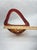 Striking mid-century hand-blown art glass basket featuring a vibrant flame-orange to deep-red ombre coloration with a...