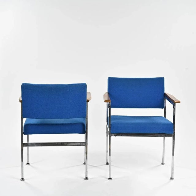 A pretty pair of Scandinavian bridge armchairs, attributed to Sigvard Bernadotte. The chromed metal square tubular...
