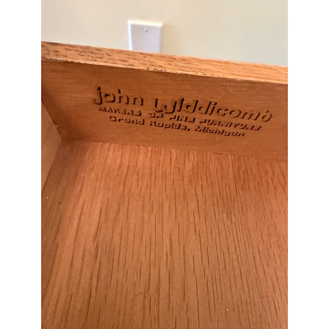 John Widdicomb Ornate writing desk has a black painted finish with gold trim and cabriole legs. Piece features a tan...