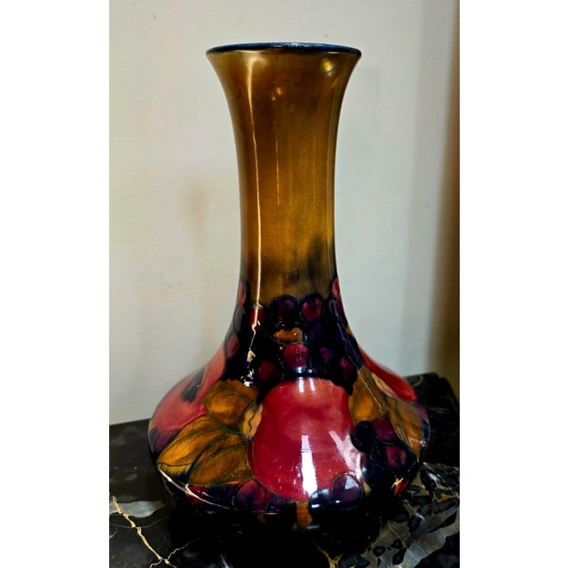 Large Vintage William Moorcroft Pomegranate vase, a highly collectible piece of English art pottery. This specific design...