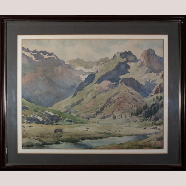 Lluís Lleó Arnau’s luminous watercolor captures a tranquil alpine valley as it unfurls beneath rugged, sunlit peaks. The...
