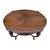 This exquisite 1930 Italian walnut center table features a stunning bookmatched top and masterfully hand-carved base....