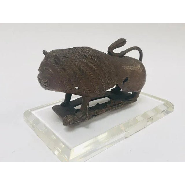 An antique unusual cast bronze of a Mythical lion beast. Bursting with character, the lion standing foursquare with his...