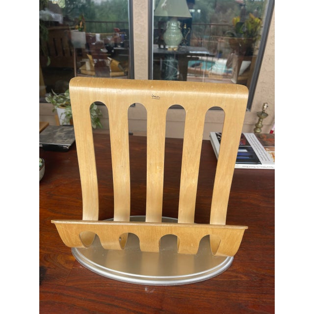 This is a vintage Michael Graves designed bentwood magazine rack. Produced in a light, blonde color plywood, the organizer...