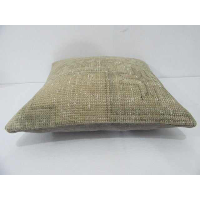 Decorative pillow cover made from a vintage Turkish handknotted rug. Backed with good quality cotton fabric. Pillow...