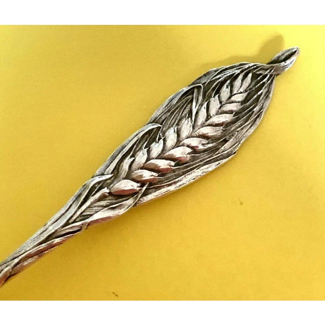 Offered is a rare early 20th century Watson-Mechanics wheat sheaf handle 5 1/2" Montgomery, MO sterling silver teaspoon....